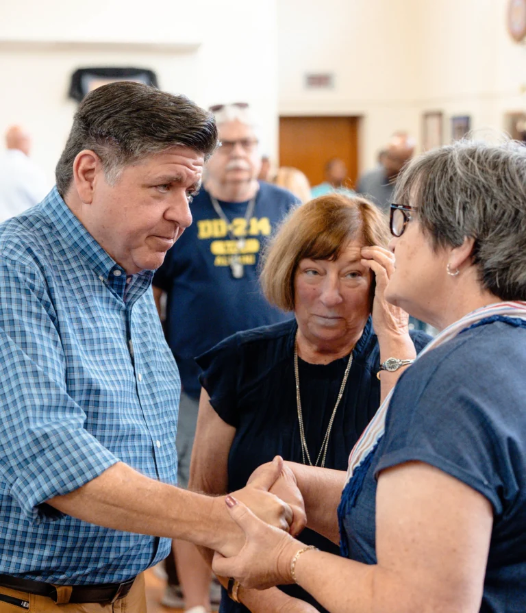 photo of Governor JB Pritzker speaking with constituents