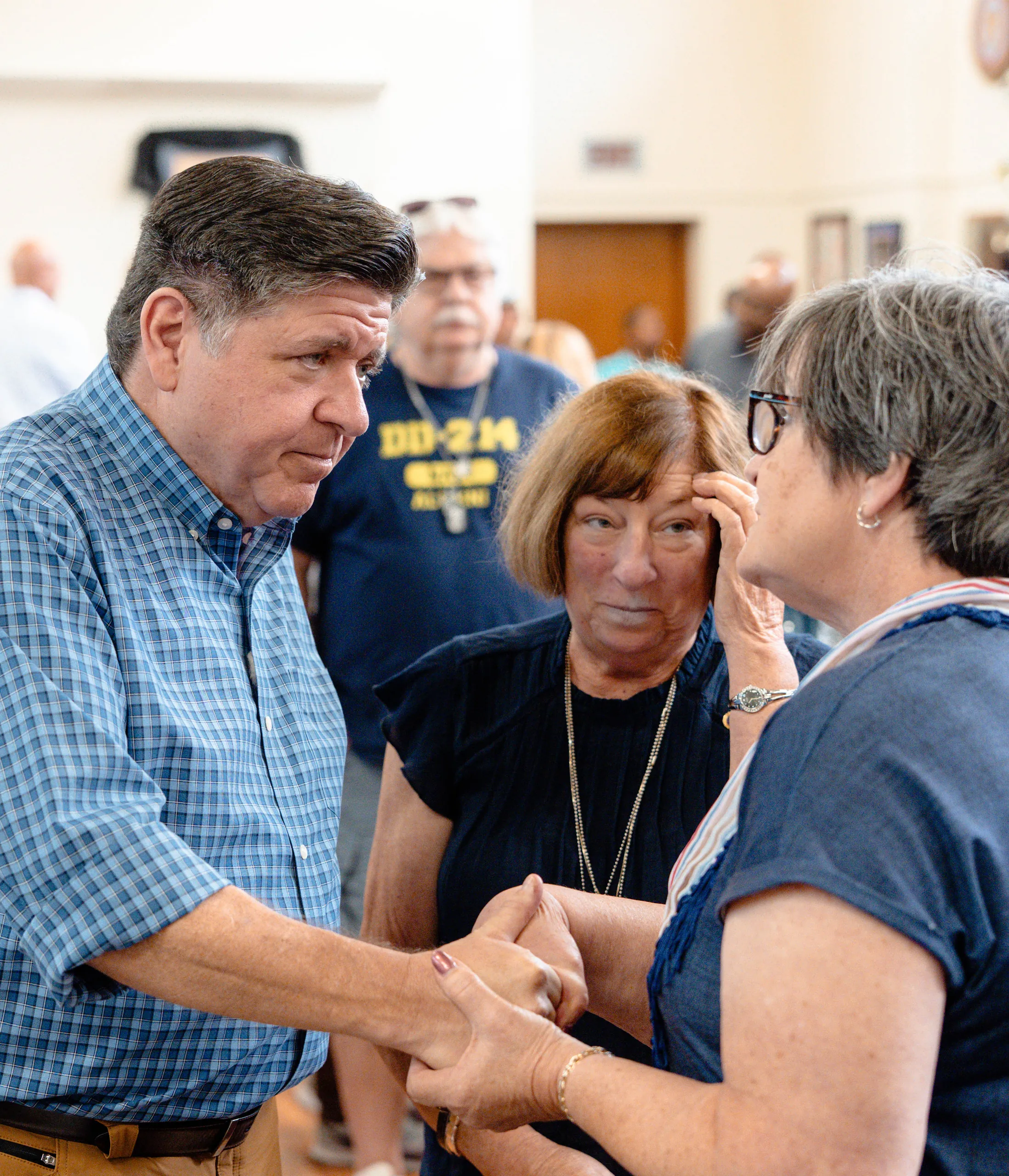 photo of Governor JB Pritzker speaking with constituents