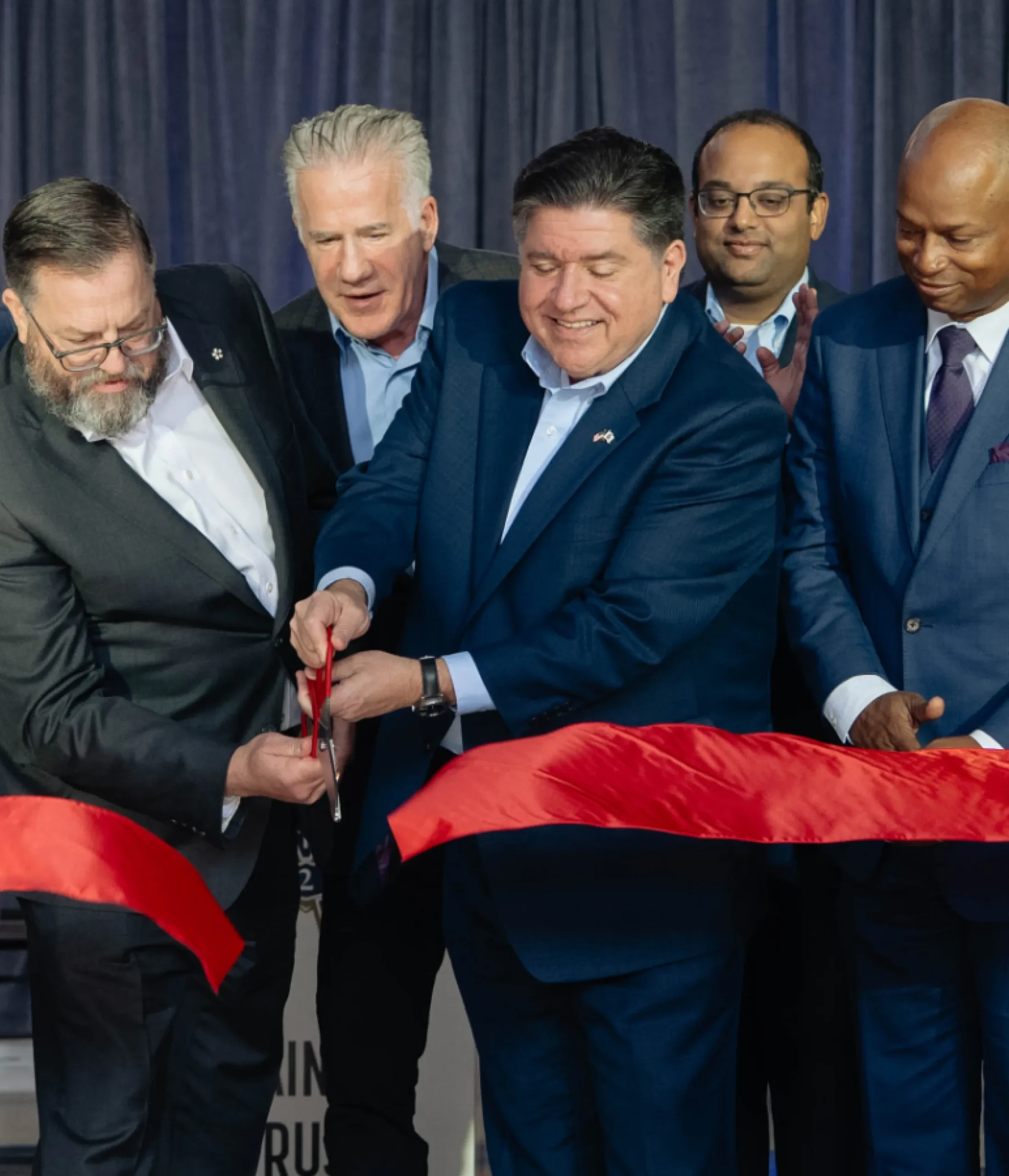 photo of Governor JB Pritzker at a ribbon cutting