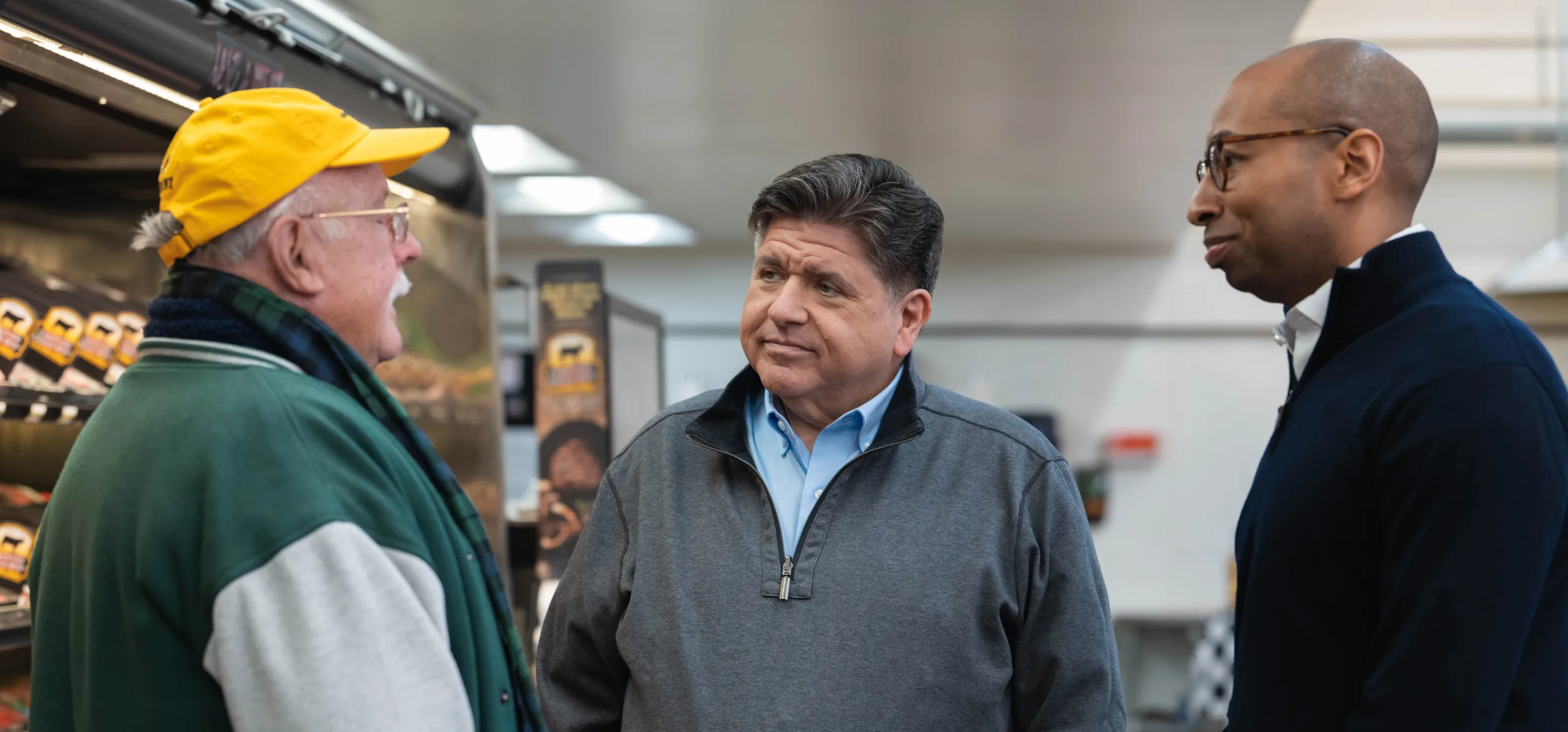 photo of Governor JB Pritzker speaking with constituent