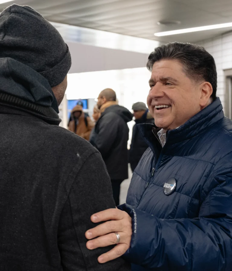 photo of Governor JB Pritzker speaking with constituent