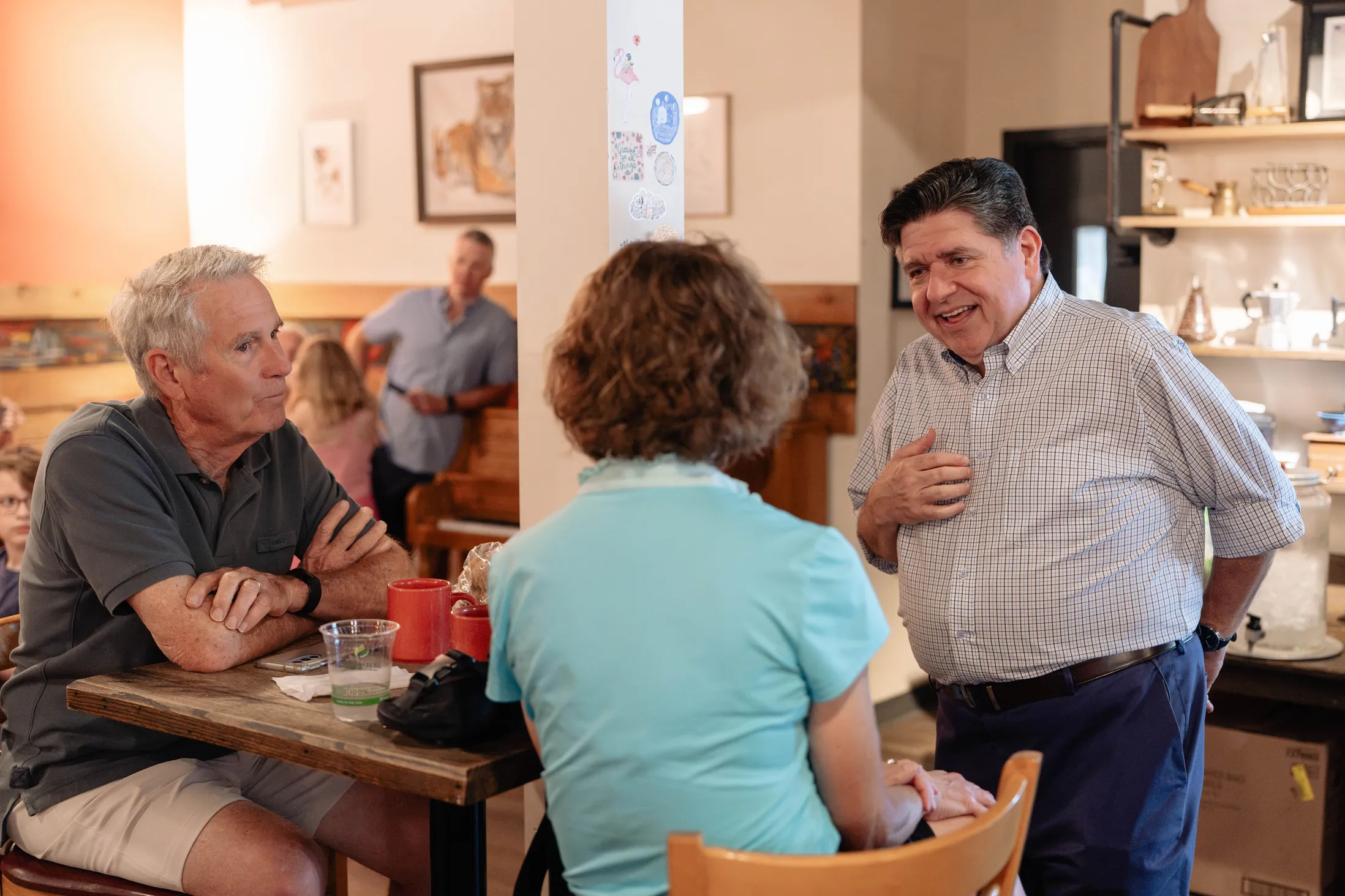 photo of Governor JB Pritzker speaking with constituents